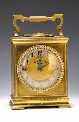 Image Table clock, France, around 1900, brass case in the style of the Anglaise Clock, Carriage Clock Case Style, display of compass and thermometer (in ring form) under the handle, bezel set with rhinestones, silver-plated dialring, visible balance (cylinder gear), seller's signature Bordoli, Bologna, large round brass plate movement, France, ext. Elevator (keys don't fit), speed control, backcover doesn't close, height with handle approx. 20cm, condition of movement/housing 2 -3
