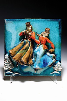 Image Ceramic relief picture, Ilse Köhler- Hohenreuther (1911-1952), Karlsruhe majolica, pair of ladies in traditional costumes skatingin a winter landscape, colored glazed, signed and dated 1949 on the reverse, traces of age, 31x31 cm