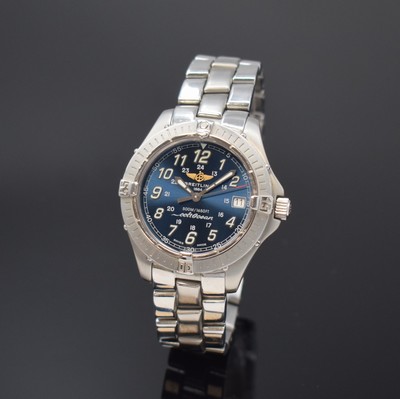 Image BREITLING Colt Ocean gents wristwatch in steel reference A64350, Switzerland around 2000, quartz, original bracelet with deployant clasp, case back and winding crown screwed down, bezel with 60-minutes graduation unidirectional revolving, blue dial with luminous numerals, silvered luminous hands, date at 3, diameter approx. 38 mm, length approx. 20,5 cm, condition 2