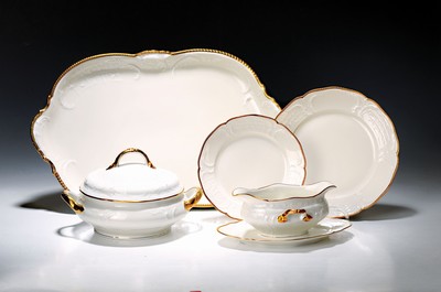 Image Dinner service, Rosenthal, Sanssouci, 20th century, porcelain, gold rim, flag with shell work in relief, 12 dinner plates D. 25cm, 12 soup plates D. 24cm, 12 bread plates D. 20.5cm, 2 lidded tureens, 2 rectangular bowls, gravy boat, 3 different sized plates, traces of age, partly slightly rubbed