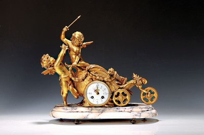 Image Pendulum, France, around 1910, marble base, onit a stylized celestial chariot with arguing cupids (1 attribute/arrow in hand sec. - removable) Regule, sec. partly bronzed, glass cover front and back enamel dial, style hands,fine regulation, pendulum movement according to: S. Marti, half-hour strike on bell H/W approx. 41x49cm, condition of movement/housing2-3, rare