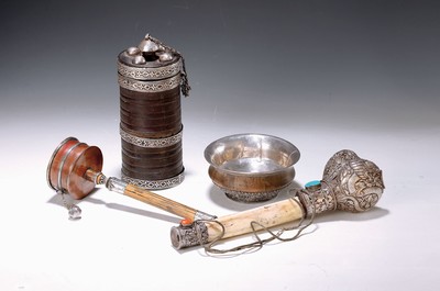 Image convolute of 4 prayer objects with silver casing, Tibet, 19th/20th c., Kangling bone trumpet, hammered sheet silver, L. 28 cm; prayer wheel, silver and copper sheet, L. 24 cm; Cover vessel H. 21 cm; silver bowl with wood core, zoomorphic decor, D. 12 cm, age group.