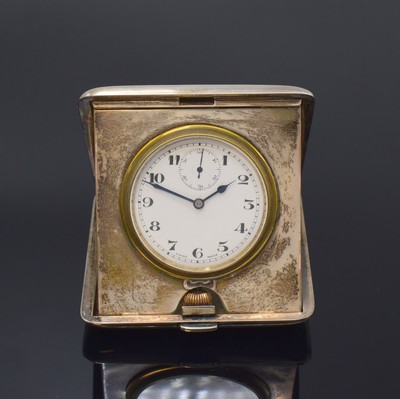 Image DOXA carriage clock in sterling silver-case, London according to hallmark 1921, manual winding, open up case dent, hinge case back, enamel dial with Arabic numerals, blued steel hands, constant second at 12, signed lever movement with fausses cotes decoration, measures closed approx. 87 x 78 mm, overhaul recommended at buyer's expense, condition 2-3